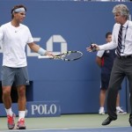 Tournament referee Earley and Nadal of Spain discuss resumption of play against Harrison of the U.S. despite light rain at the U.S. Open tennis championships in New York